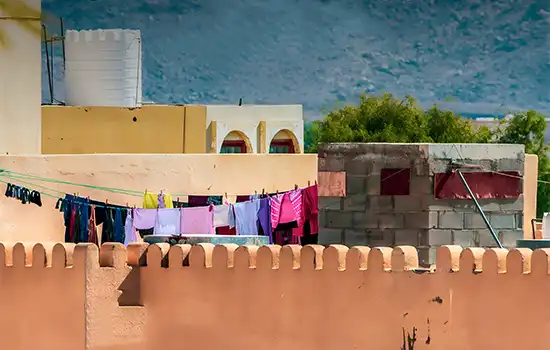 muscat bans uncovered laundry on balconies