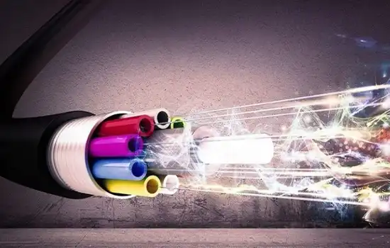 Fiber optic cable with colored cores and moving light beams.
