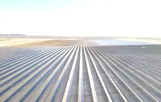 Aerial view of Oman’s Manah 1 and 2 solar plants, featuring over 2 million photovoltaic panels as a testament to clean energy commitment.
