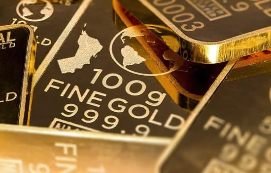 Image showing 100g gold bars featuring the official emblem of Oman, highlighting new tax-free gold purchase regulations in Oman – 2025
