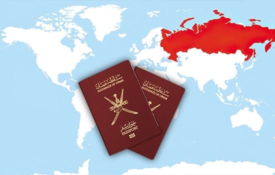 Visa-Free Travel Between Oman and Russia: Key Focus of Sultan’s State Visit to Moscow 7 Two Omani passports placed over a world map highlighting Russia, symbolizing the mutual visa waiver agreement, Oman Russia visa-free, Sultan visit Moscow, Omani passport Russia,